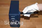 Save insertion of a film strip into a scanner with a cotton glove