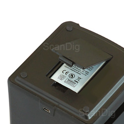 The battery compartment of the reflecta x4-scan at the bottom of the casing; the USB-connection at the front